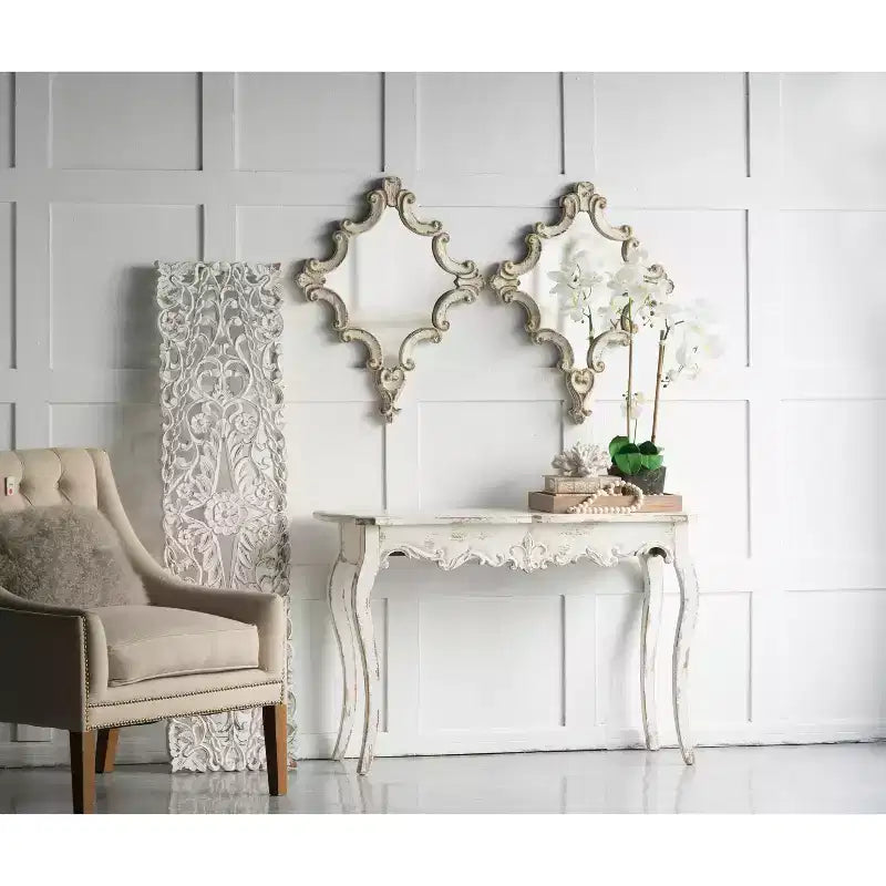 Specchio da parete ottagonale con cornice a volute