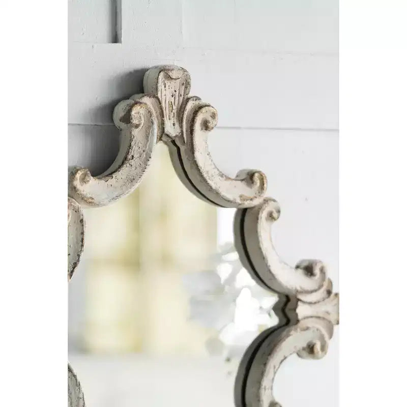 Specchio da parete ottagonale con cornice a volute