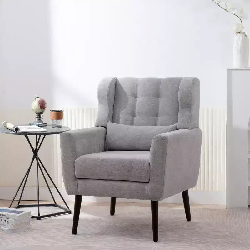 Poltroncina d'accento in ciniglia con cuscino decorativo e gambe affusolate in legno