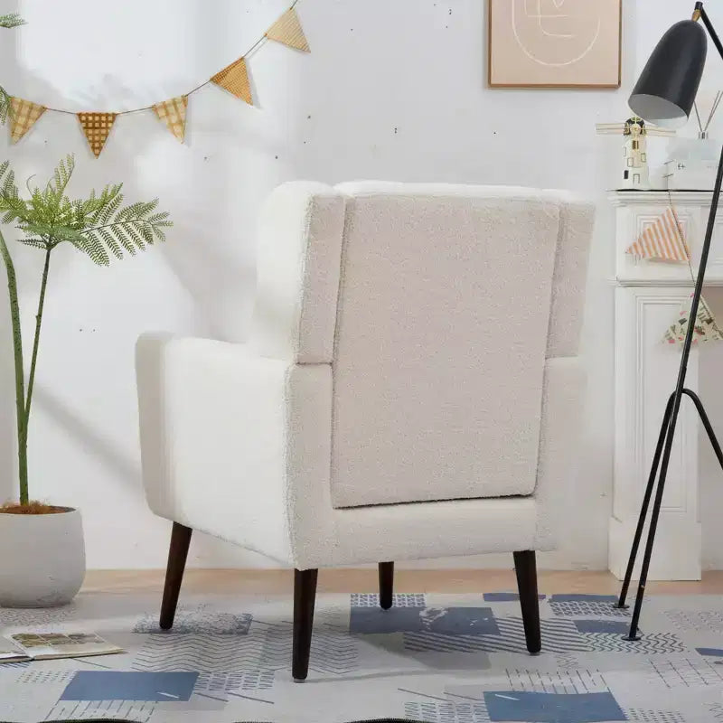 Poltroncina d'accento in ciniglia con cuscino decorativo e gambe affusolate in legno