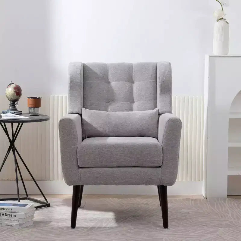 Poltroncina d'accento in ciniglia con cuscino decorativo e gambe affusolate in legno